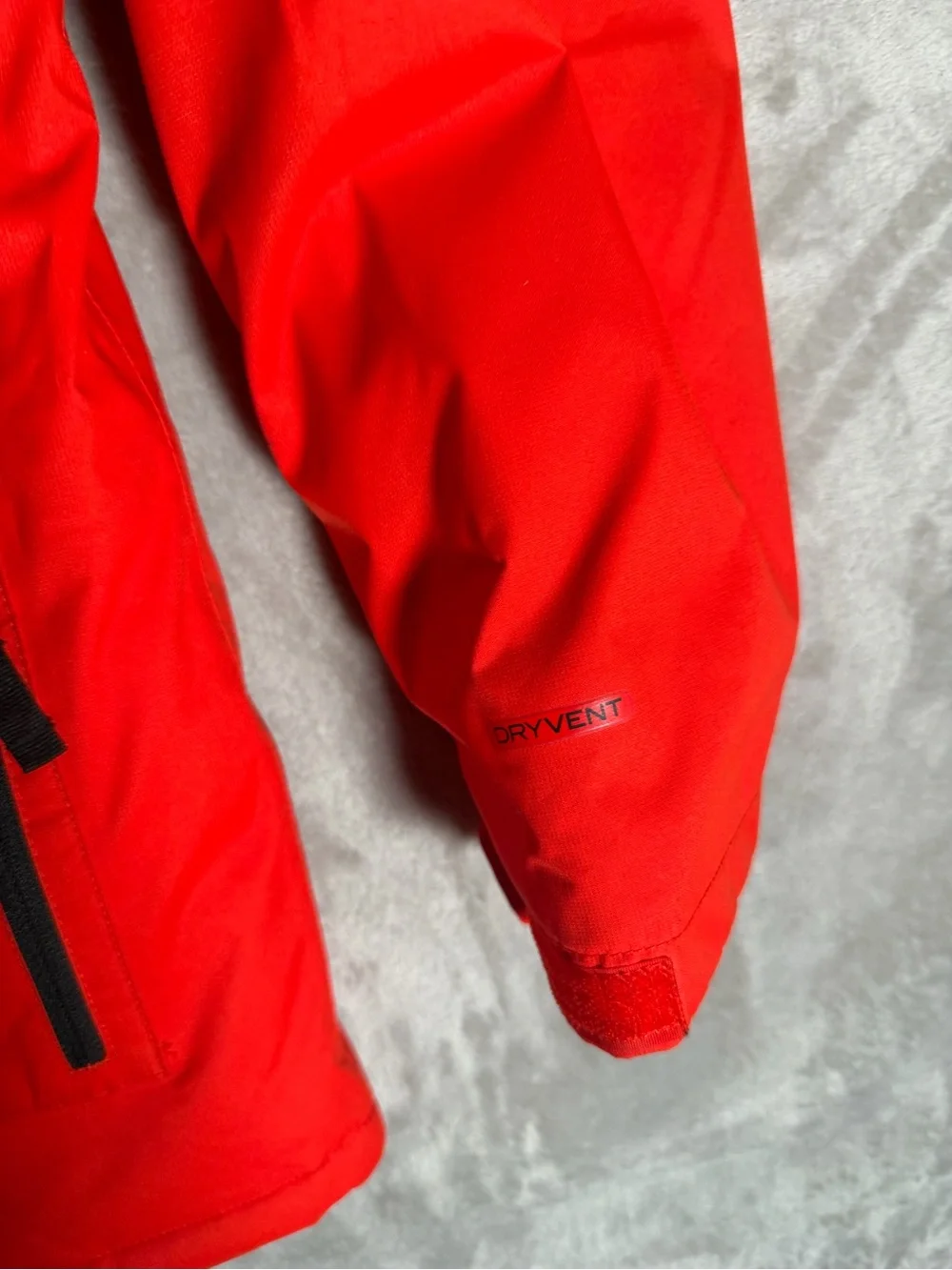 The North Face Red and Black Hooded Raincoat with Patterned Lining